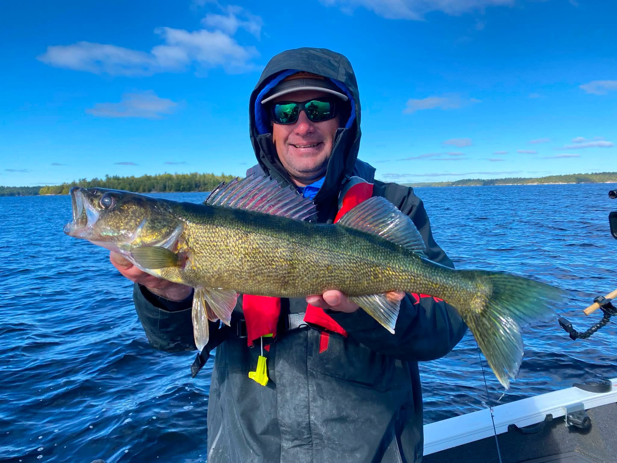 Jason Mitchell holding a trophy walleye
